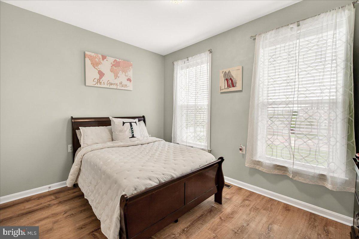 1094 Holden Road Frederick, MD 21701 - Photo 20 of 92 a large bed sitting in a bedroom next to a window