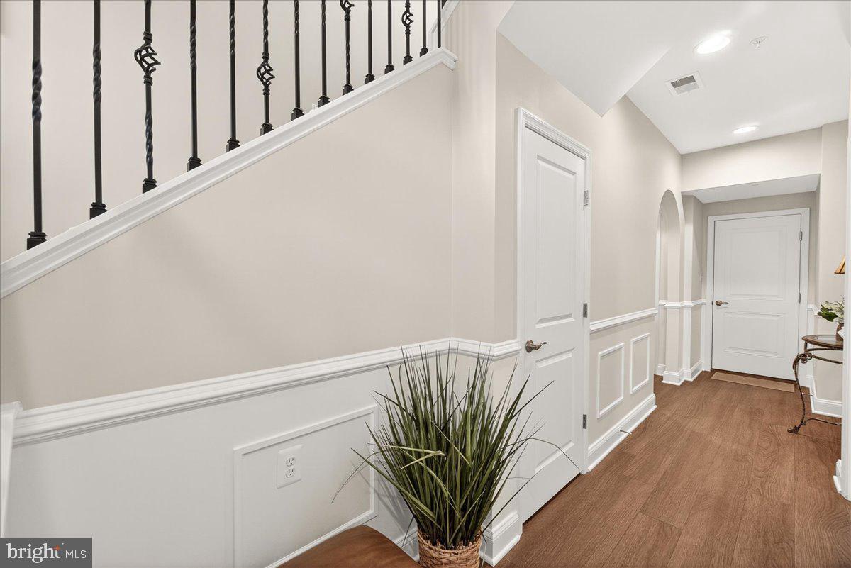 1094 Holden Road Frederick, MD 21701 - Photo 38 of 92 a view of a hallway with wooden floor and staircase