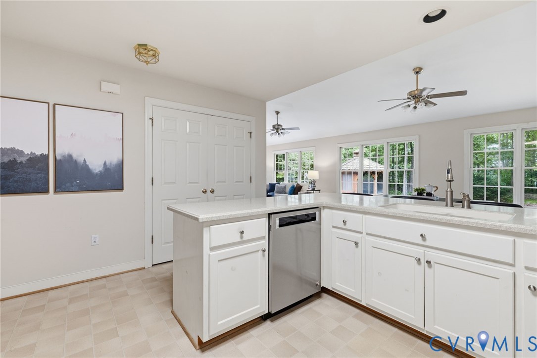 2615 Salisbury Road Midlothian, VA 23113 - Photo 2 of 36 a view of cabinets a sink and dishwasher with wooden floor