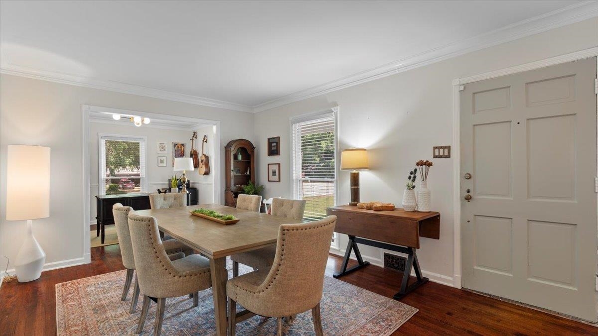 5596 Rich Road Memphis, TN 38120 - Photo 11 of 34 a dining room with furniture and wooden floor