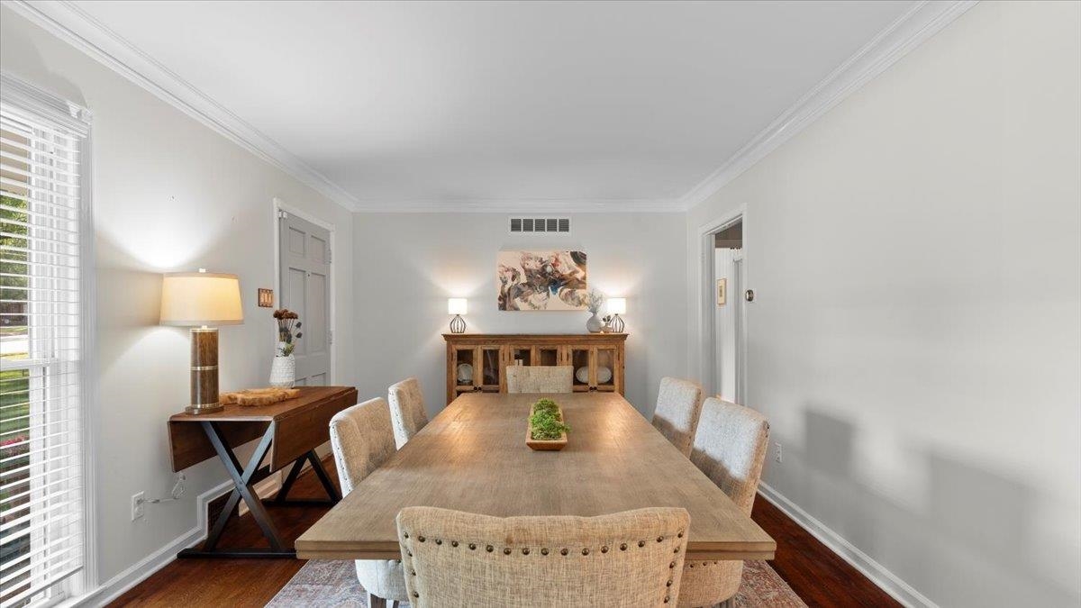 5596 Rich Road Memphis, TN 38120 - Photo 12 of 34 a living room with furniture and a chandelier