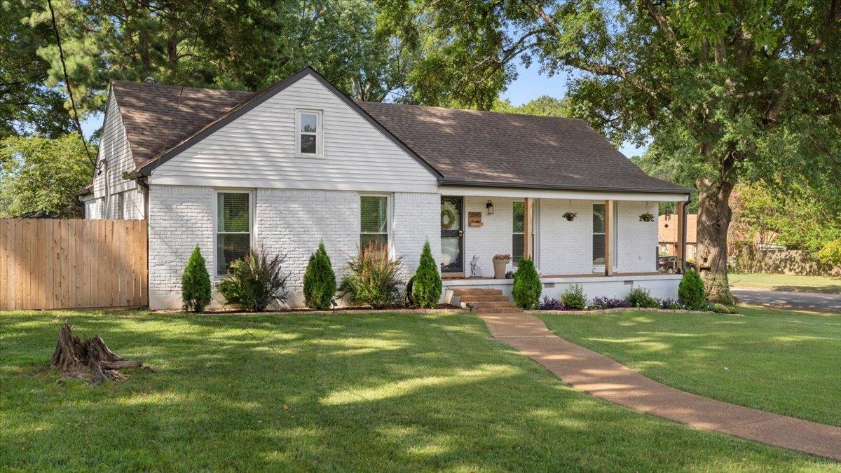 5596 Rich Road Memphis, TN 38120 - Photo 2 of 34 a view of a house with a yard