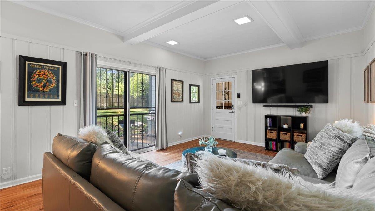 5596 Rich Road Memphis, TN 38120 - Photo 23 of 34 a living room with furniture and a flat screen tv