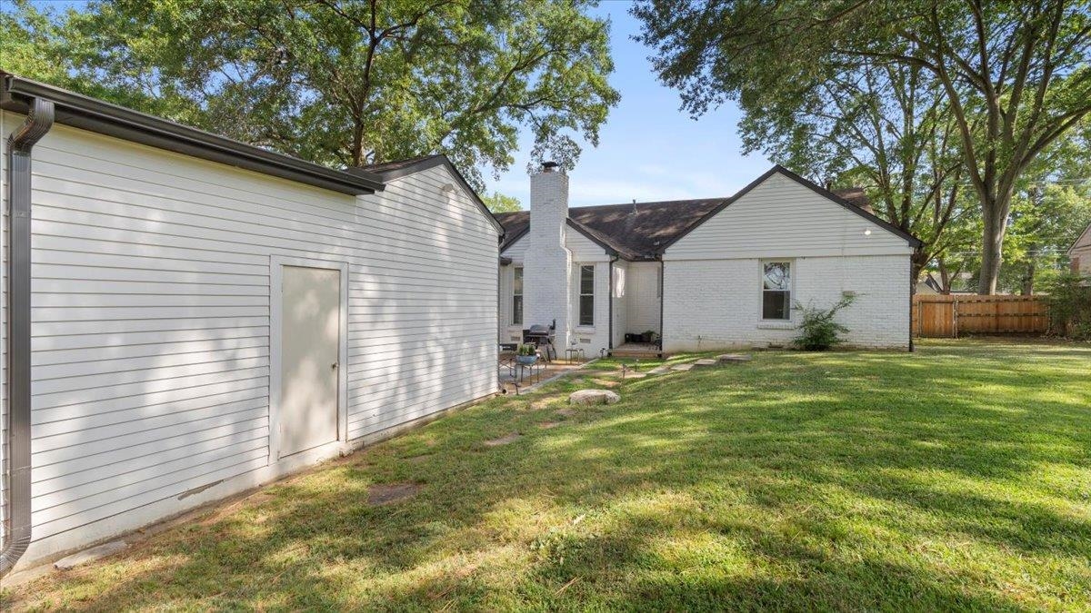 5596 Rich Road Memphis, TN 38120 - Photo 26 of 34 a view of a house with a yard