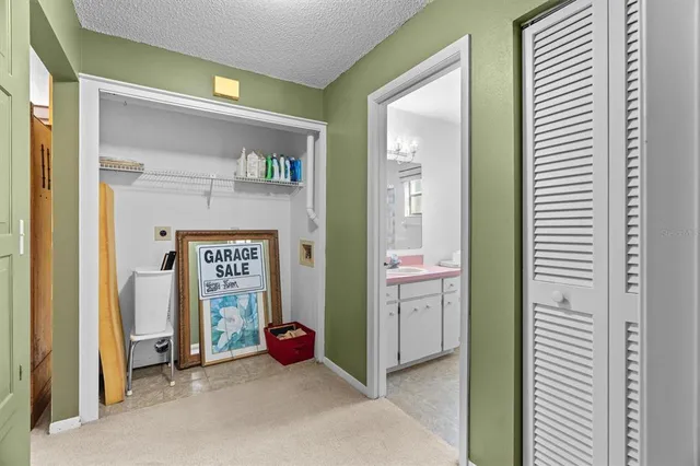 a bathroom with a sink vanity mirror and toilet