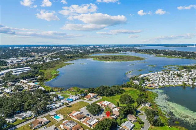 a building outdoor space with patio furniture and potted plants