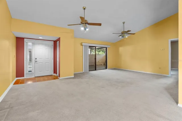 a view of a kitchen with a sink and a refrigerator
