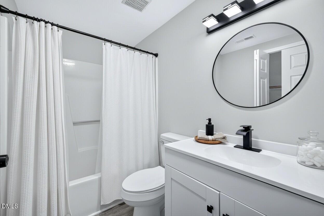 708 Powell Drive, Unit A Raleigh, NC 27606 - Photo 7 of 20 Bath on the main floor and has been virtually staged