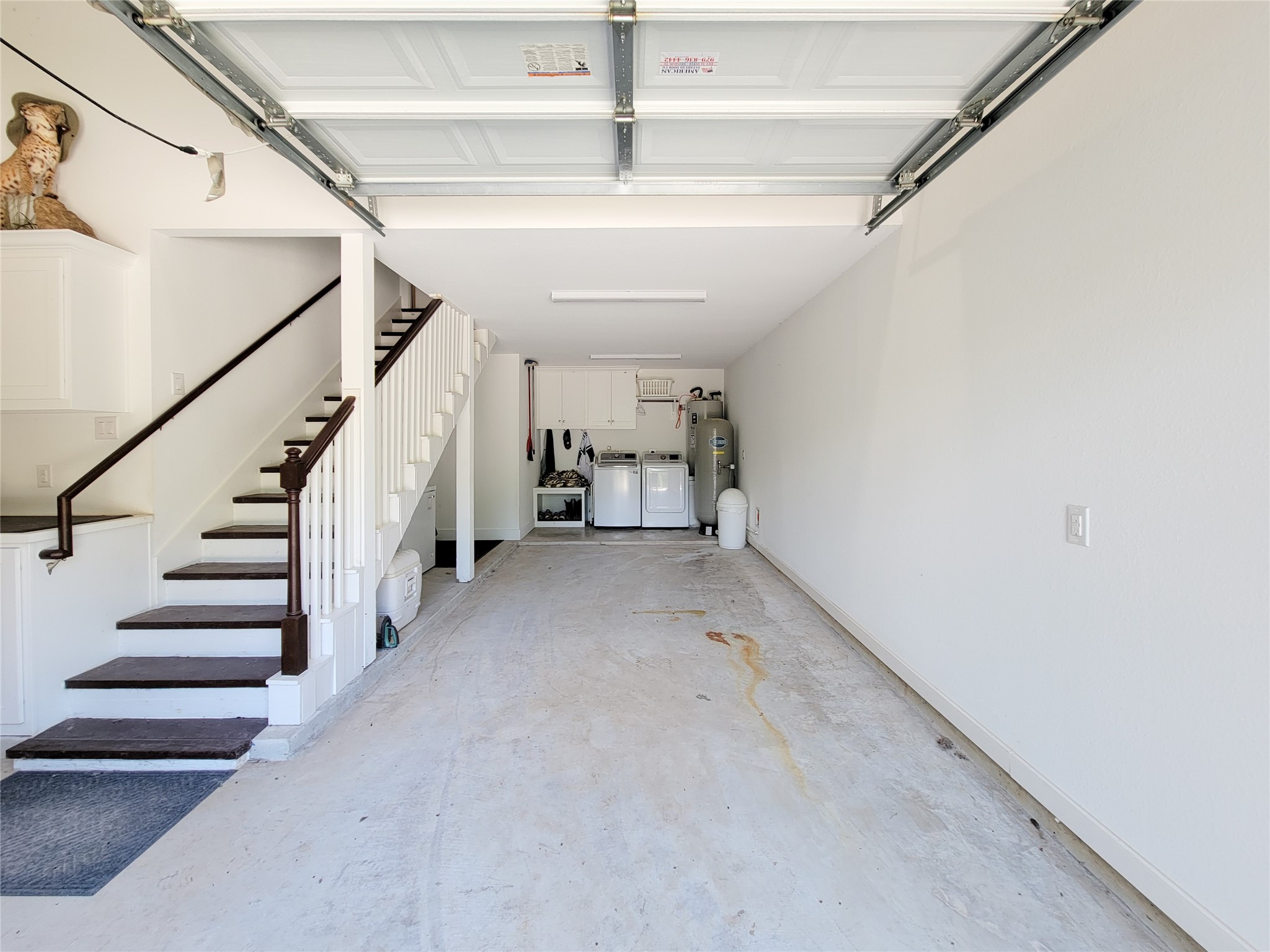 4937 Wolff Road Round Top, TX 78954 - Photo 27 of 31 Spacious garage with convenient stairs leading to the upper level.