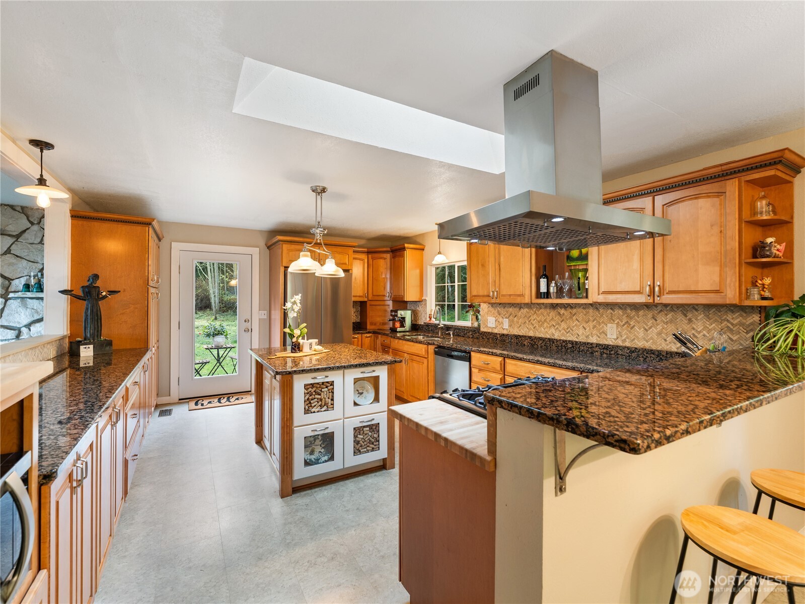 1881 Fort Nugent Road Oak Harbor, WA 98277 - Photo 14 of 38 a kitchen with stainless steel appliances granite countertop a stove and a sink