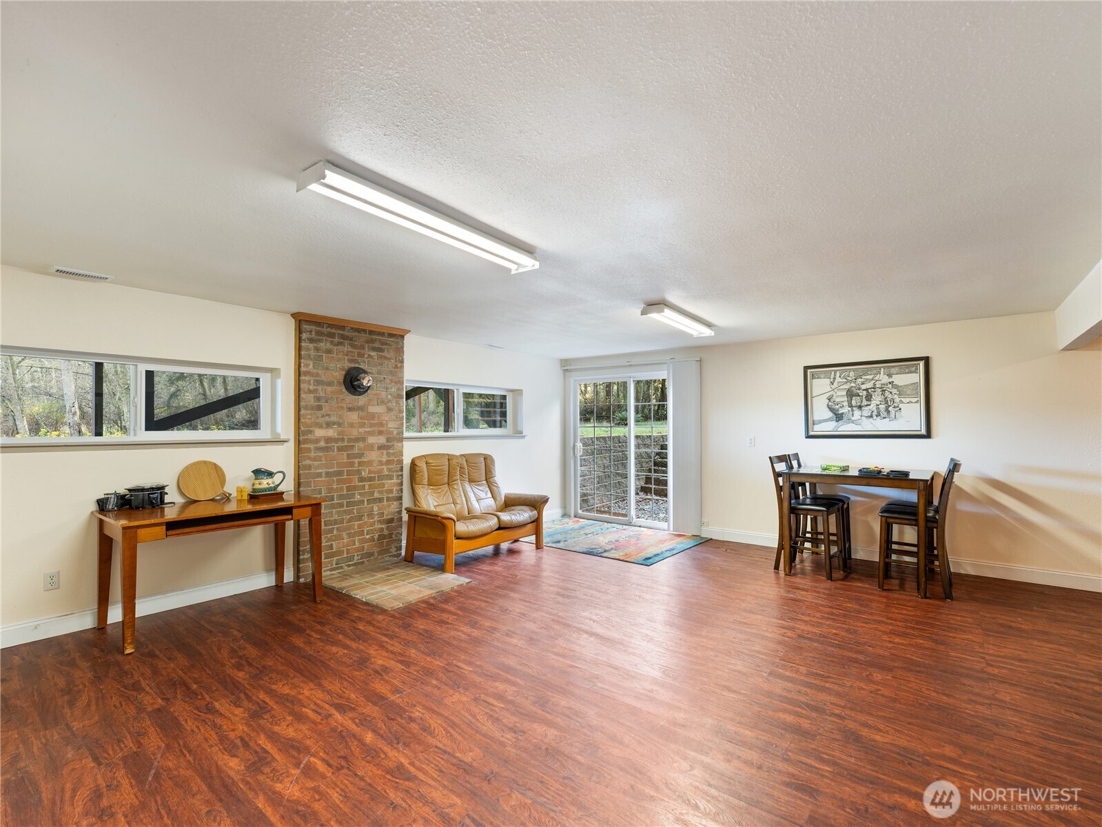 1881 Fort Nugent Road Oak Harbor, WA 98277 - Photo 23 of 38 a living room with furniture and a wooden floor