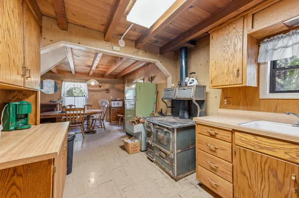 a view of a kitchen with furniture and a window