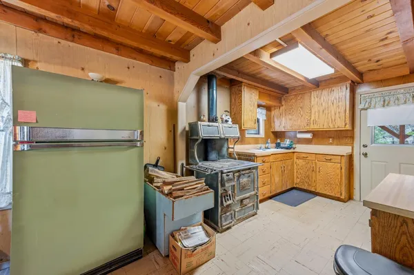 a kitchen with a sink appliances and cabinets