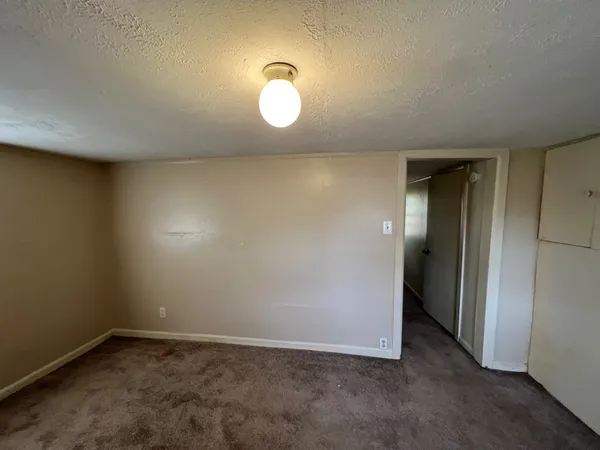 an empty room with a mirror