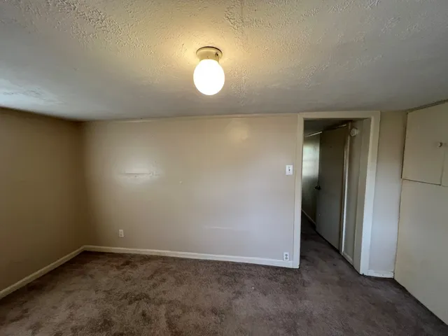 an empty room with a mirror