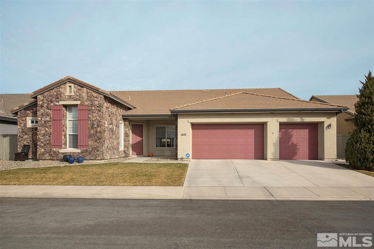 1675 Greycrest Way Reno, NV 89521 - Photo 1 of 25 a view of a building with a yard