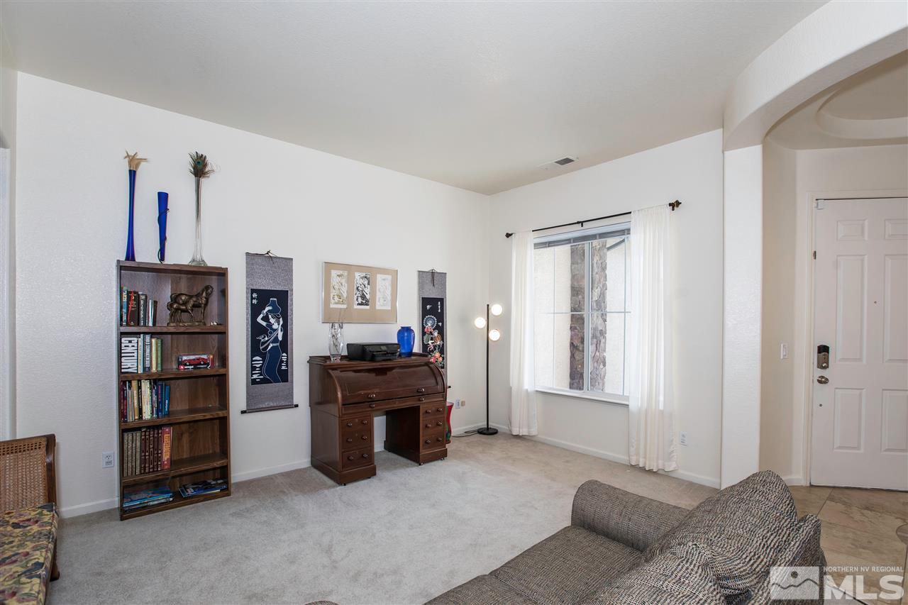 1675 Greycrest Way Reno, NV 89521 - Photo 11 of 25 a living room with furniture cabinets and window