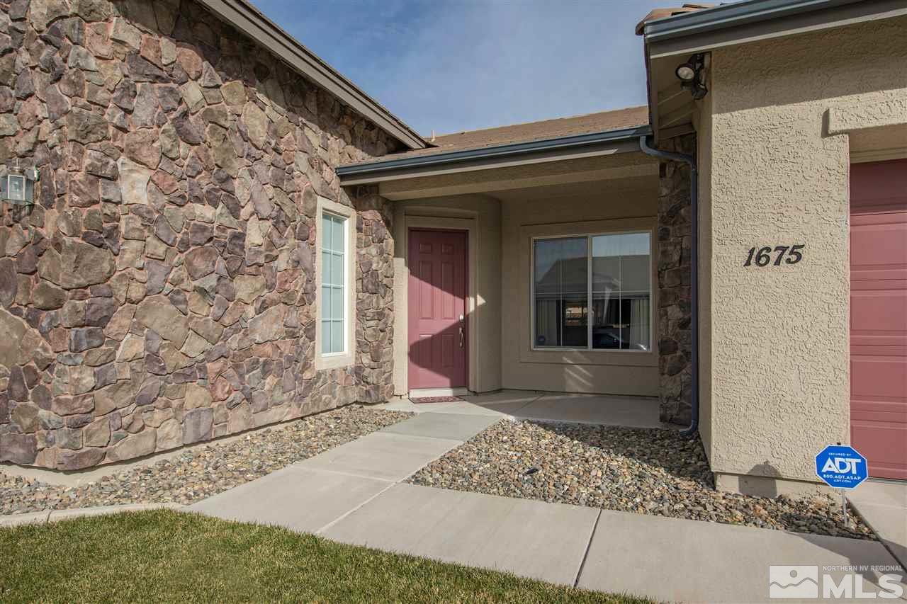 1675 Greycrest Way Reno, NV 89521 - Photo 2 of 25 a front view of a house