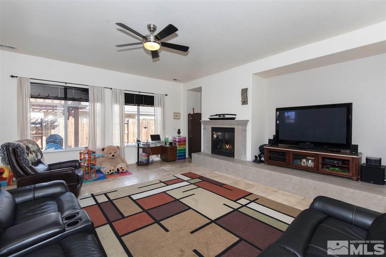 1675 Greycrest Way Reno, NV 89521 - Photo 5 of 25 a living room with furniture and a flat screen tv