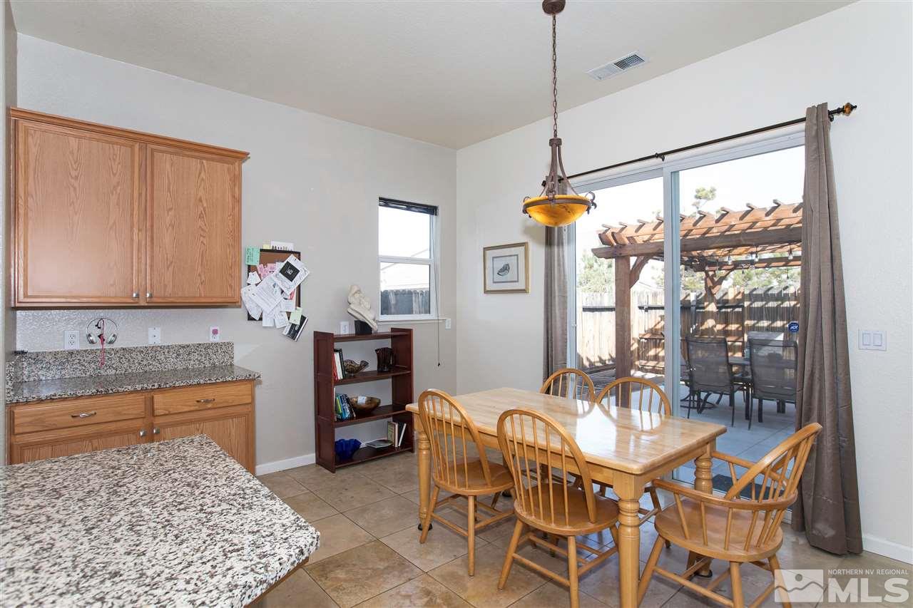 1675 Greycrest Way Reno, NV 89521 - Photo 8 of 25 a dining room with furniture and window