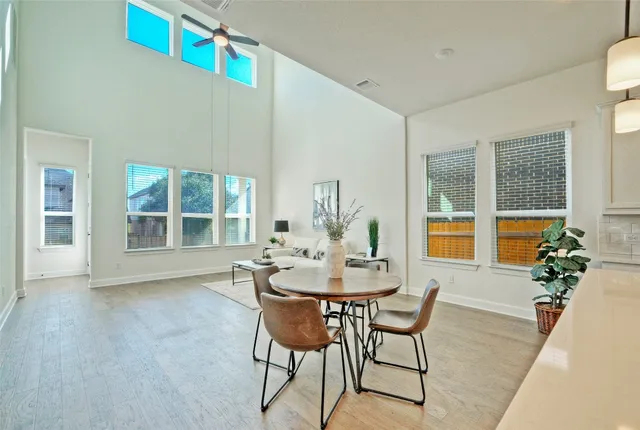 a large kitchen with kitchen island a large counter top space a sink stainless steel appliances and cabinets