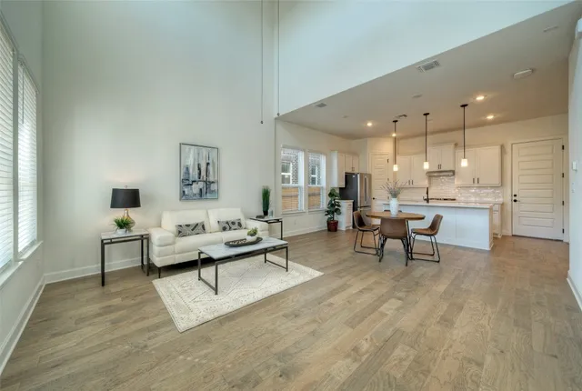 a view of a dining room with furniture window and wooden floor