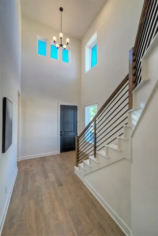 a view of an entryway with a chandelier