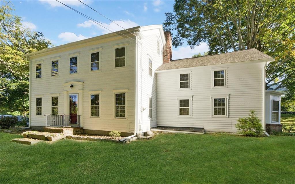 73 Obtuse Hill Road Brookfield, CT 06804 - Photo 1 of 1 a front view of a house with a yard