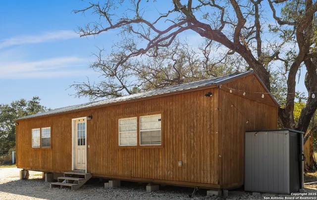 an aerial view of house with yard and mountain view