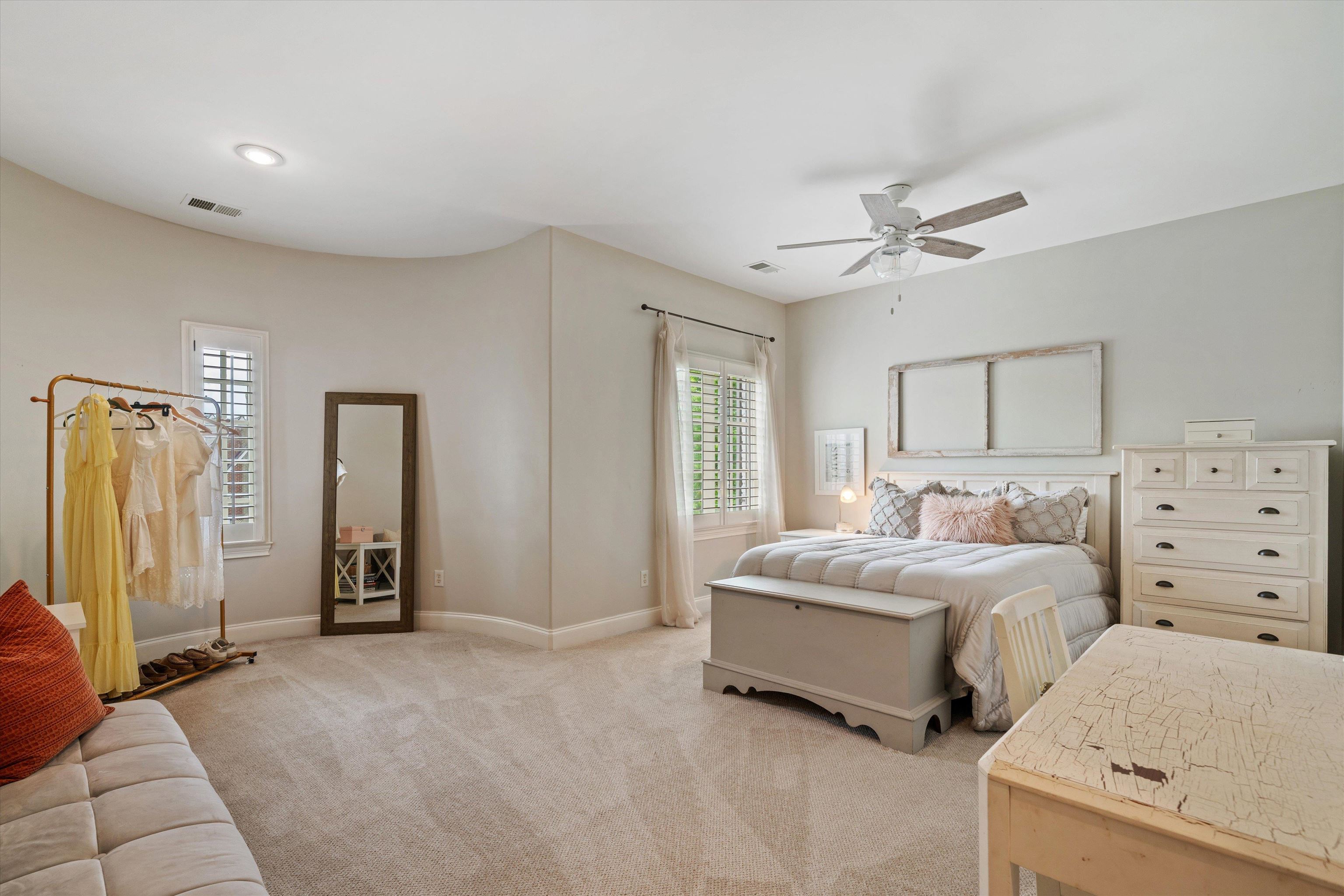 1328 Bridgepointe Drive Collierville, TN 38017 - Photo 25 of 40 a spacious bedroom with two beds and a chandelier