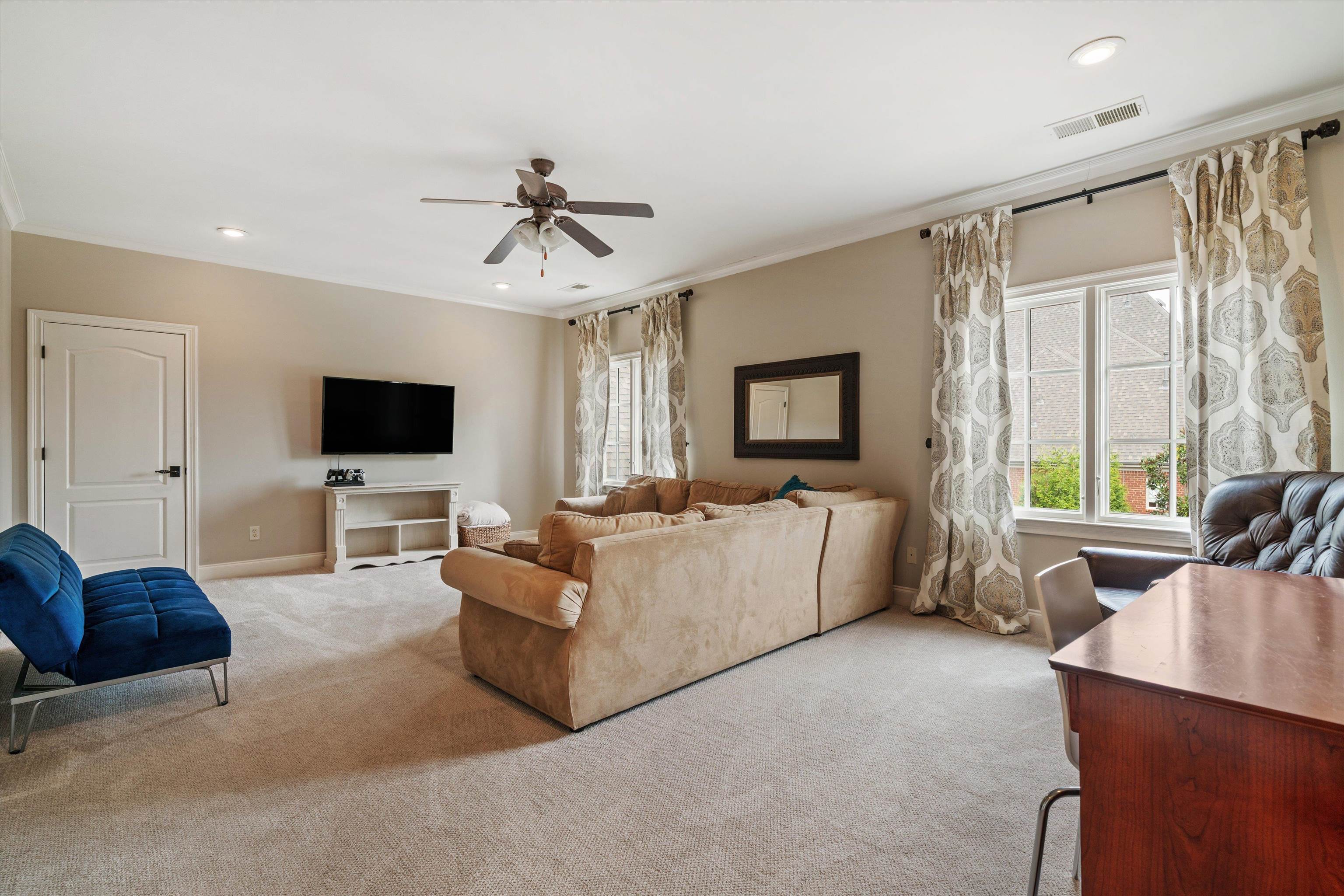 1328 Bridgepointe Drive Collierville, TN 38017 - Photo 31 of 40 a living room with furniture and a flat screen tv