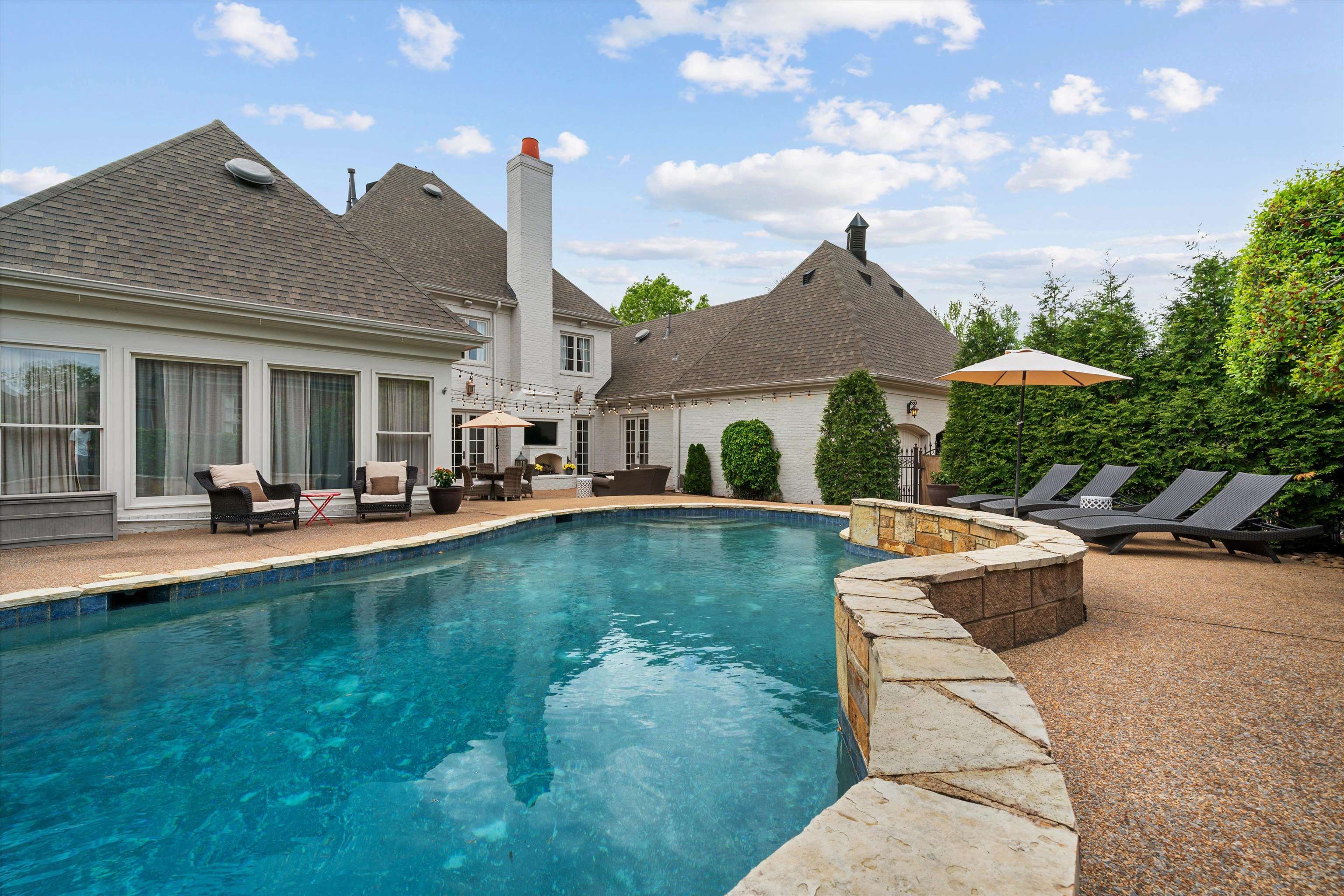 1328 Bridgepointe Drive Collierville, TN 38017 - Photo 36 of 40 a view of a house with swimming pool and sitting area