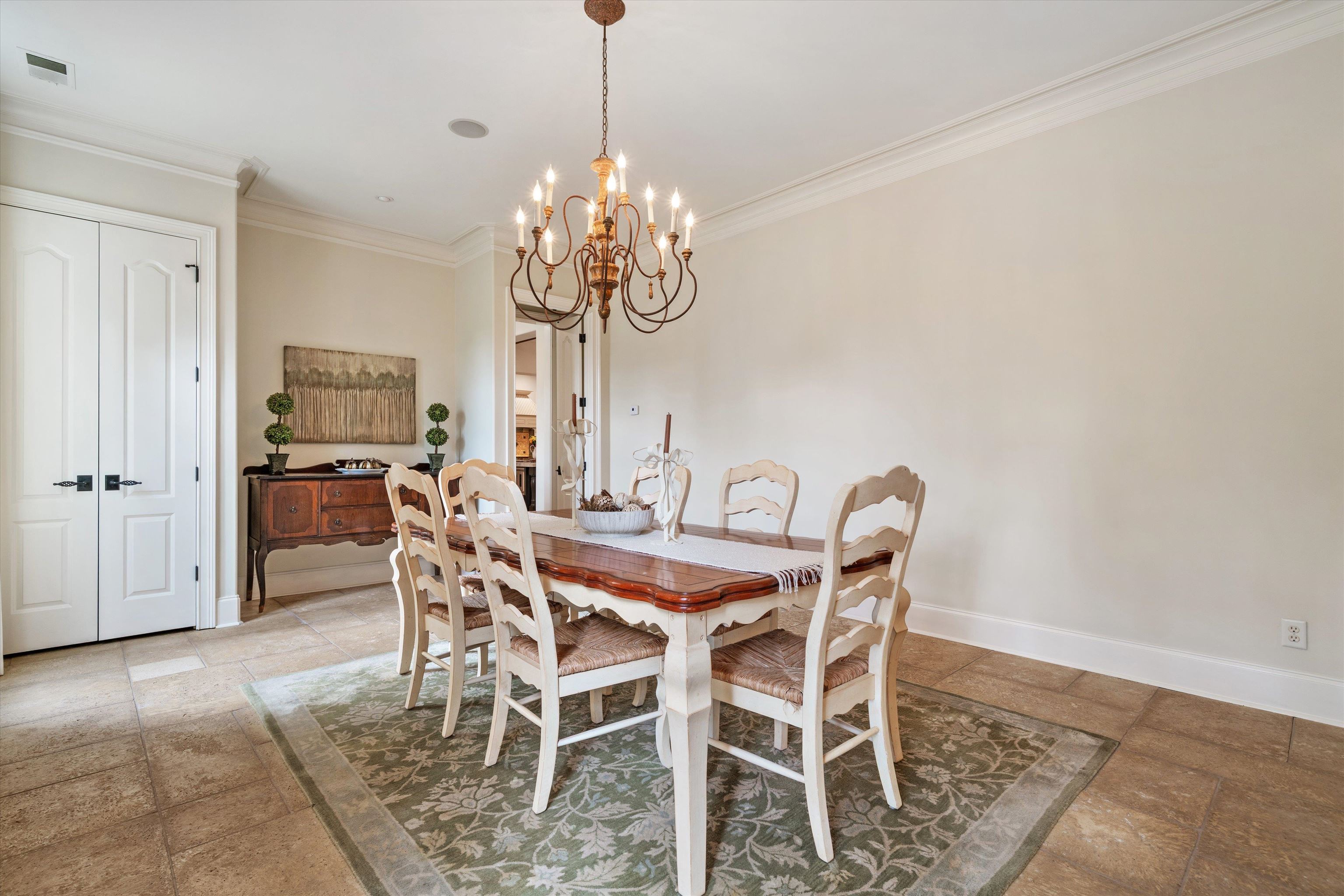 1328 Bridgepointe Drive Collierville, TN 38017 - Photo 7 of 40 a view of a dining room with furniture and chandelier