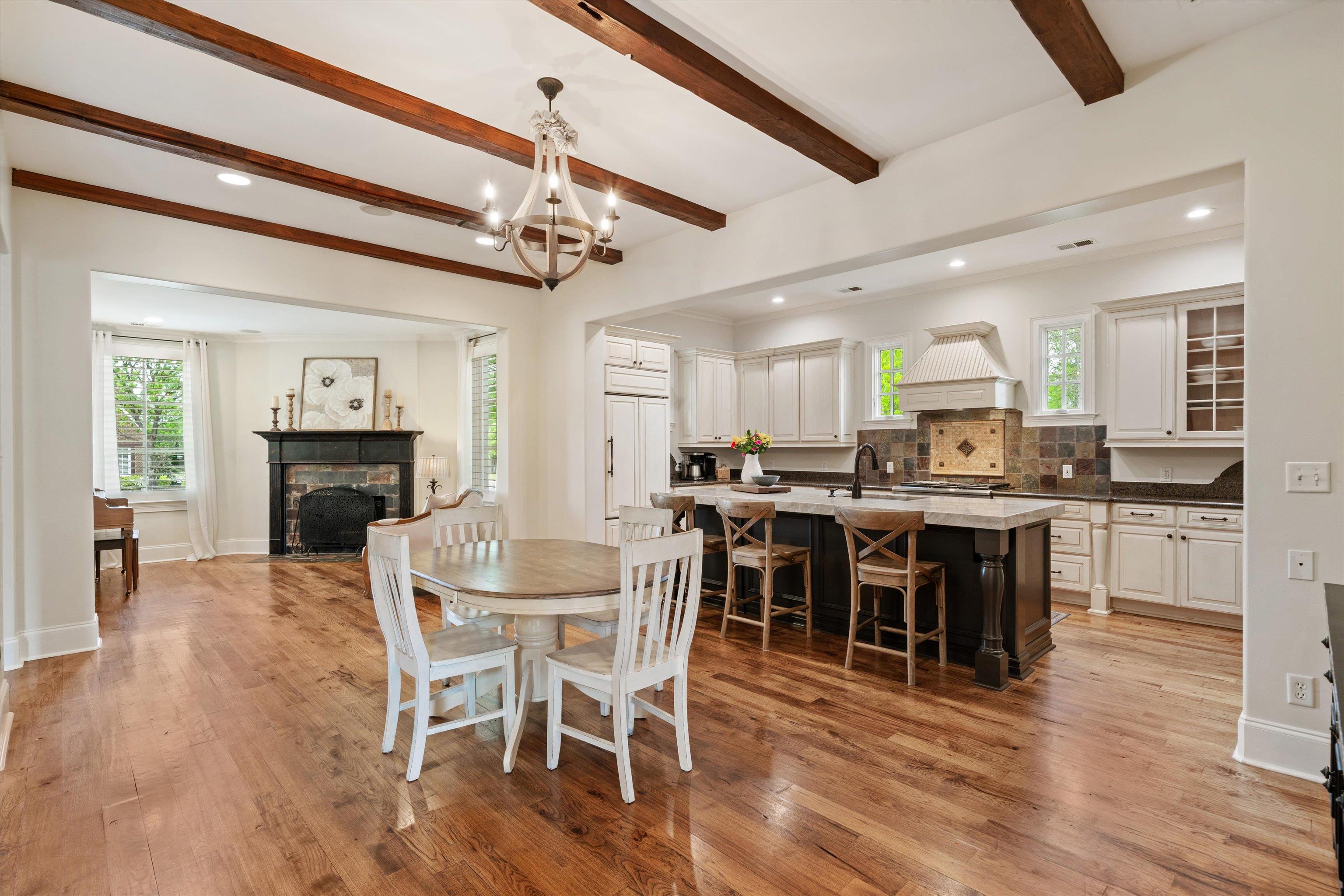 1328 Bridgepointe Drive Collierville, TN 38017 - Photo 8 of 40 a view of a dining room with furniture wooden floor and chandelier