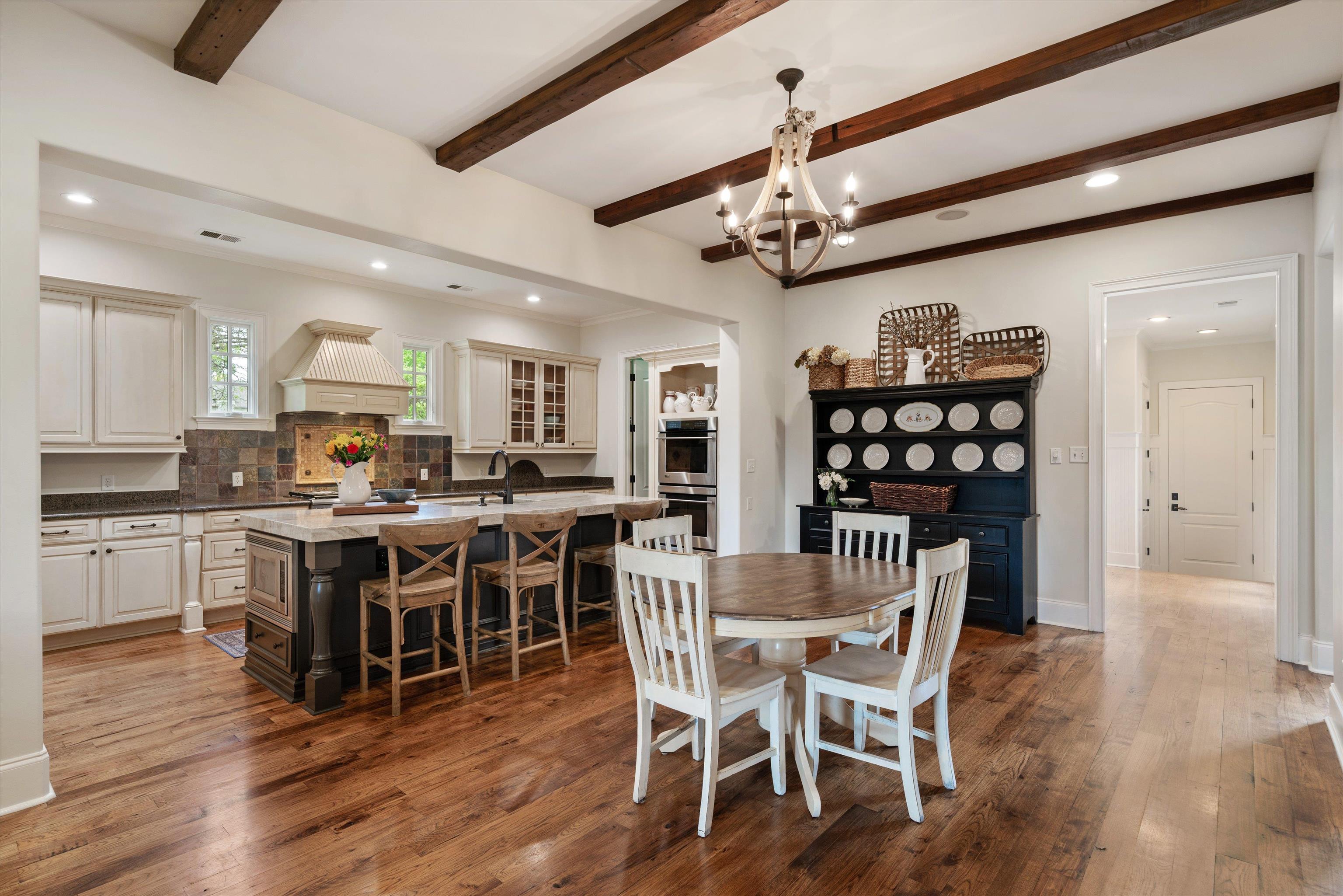 1328 Bridgepointe Drive Collierville, TN 38017 - Photo 9 of 40 a view of a dining room with furniture and wooden floor