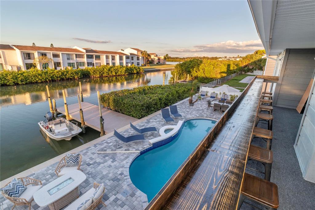 328 6th Avenue Indian Rocks Beach, FL 33785 - Photo 11 of 45 a view of swimming pool with outdoor seating