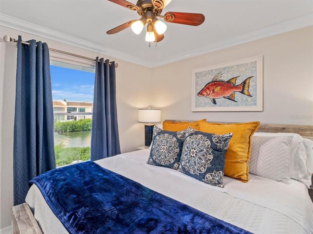 328 6th Avenue Indian Rocks Beach, FL 33785 - Photo 17 of 45 a bed sitting in a bedroom next to a window