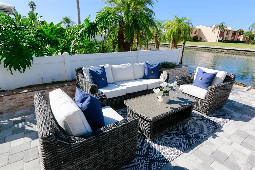 328 6th Avenue Indian Rocks Beach, FL 33785 - Photo 18 of 45 a outdoor living room with furniture and a potted plant