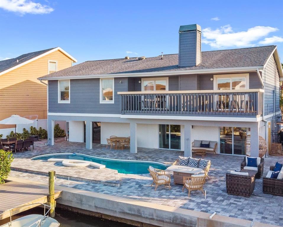 328 6th Avenue Indian Rocks Beach, FL 33785 - Photo 21 of 45 a front view of house with yard and outdoor seating