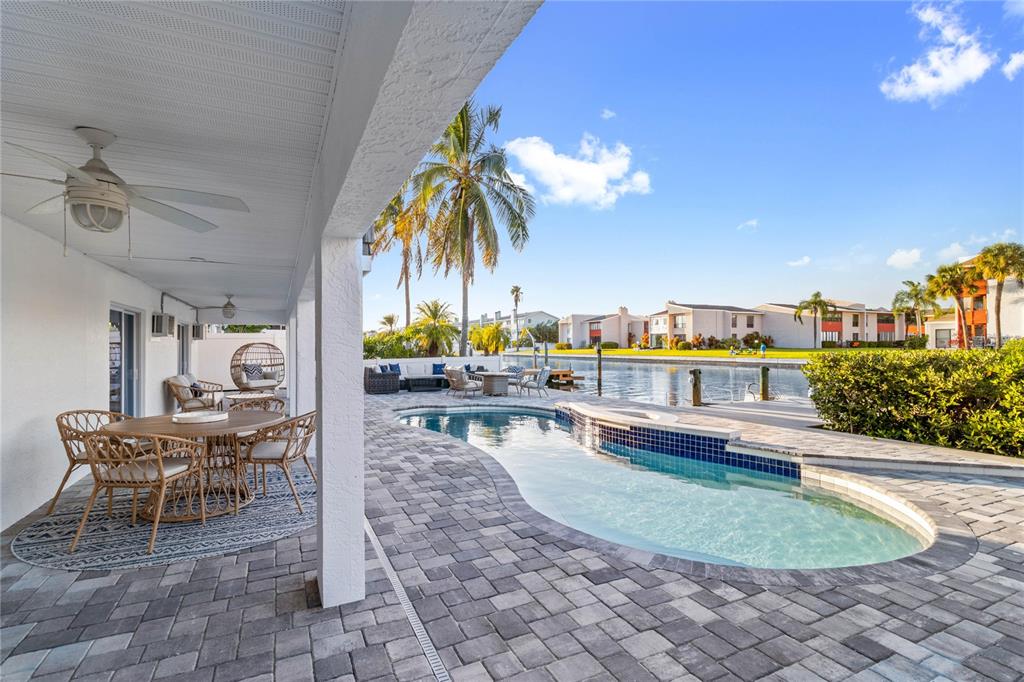 328 6th Avenue Indian Rocks Beach, FL 33785 - Photo 23 of 45 a view of a chairs and table in patio