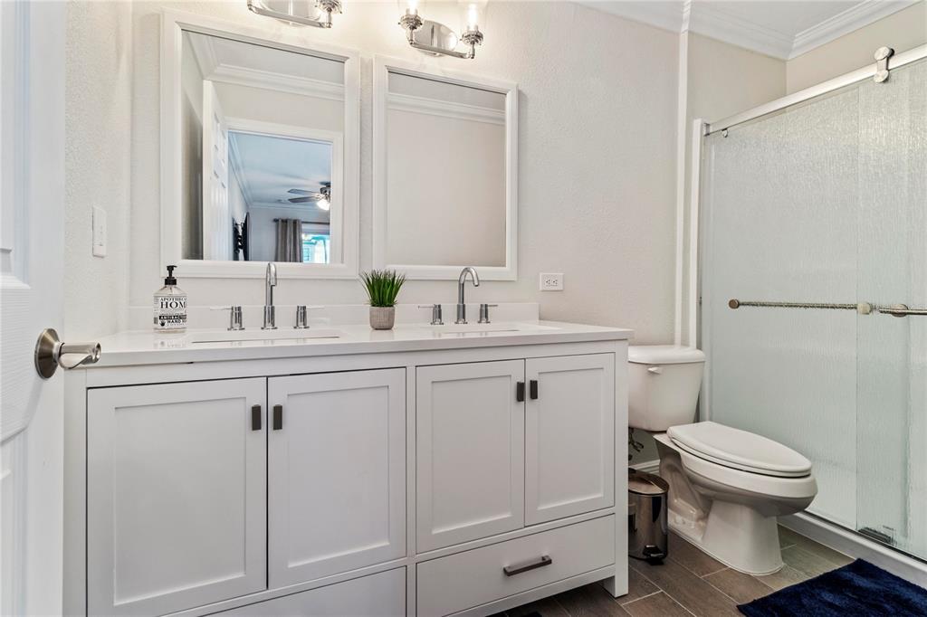 328 6th Avenue Indian Rocks Beach, FL 33785 - Photo 24 of 45 a bathroom with a sink toilet and mirror