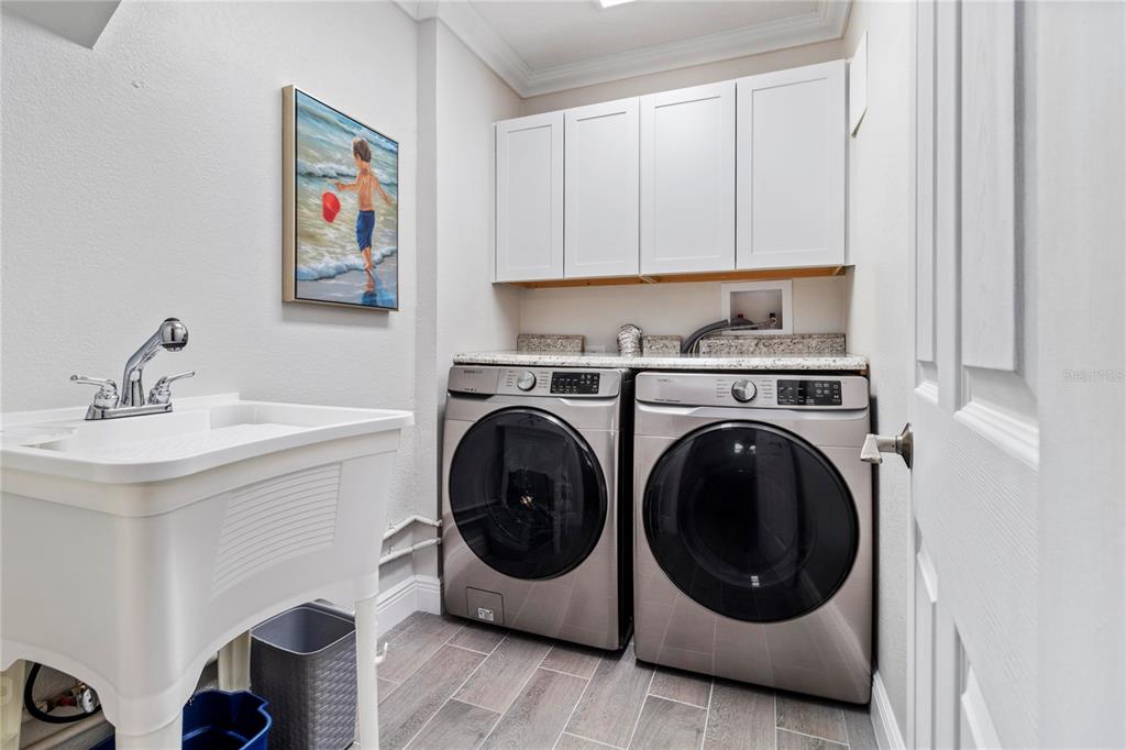 328 6th Avenue Indian Rocks Beach, FL 33785 - Photo 25 of 45 a utility room with sink dryer and washer
