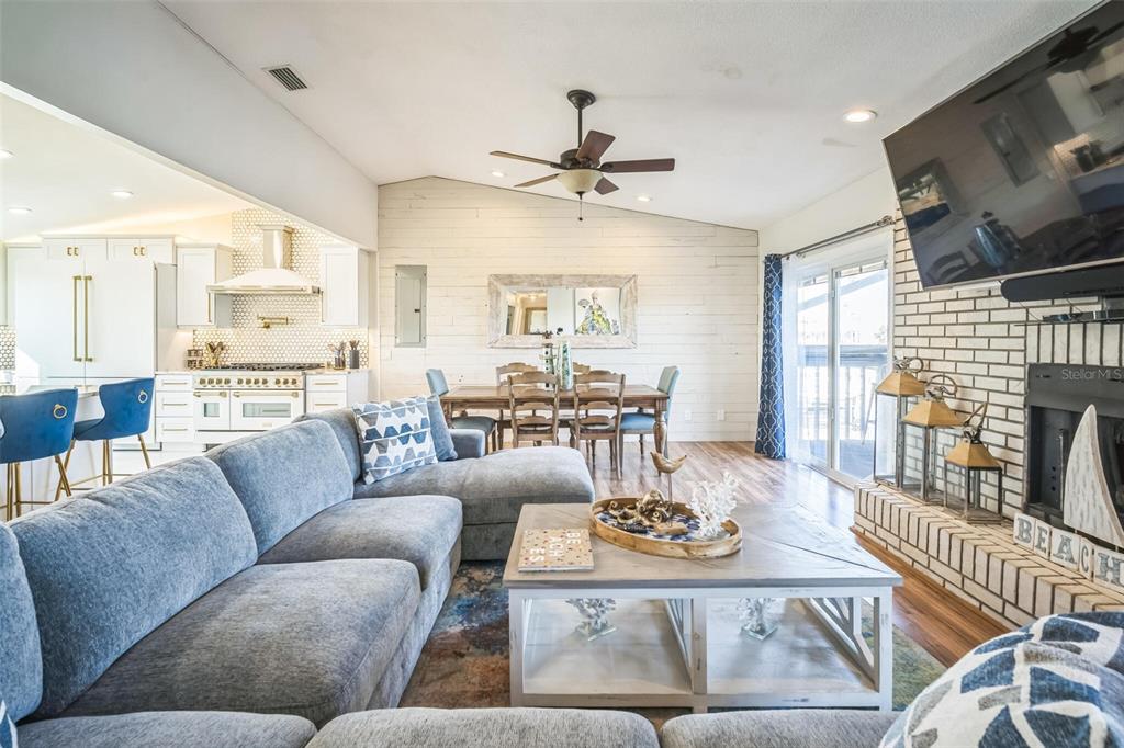 328 6th Avenue Indian Rocks Beach, FL 33785 - Photo 34 of 45 a living room with furniture and a flat screen tv