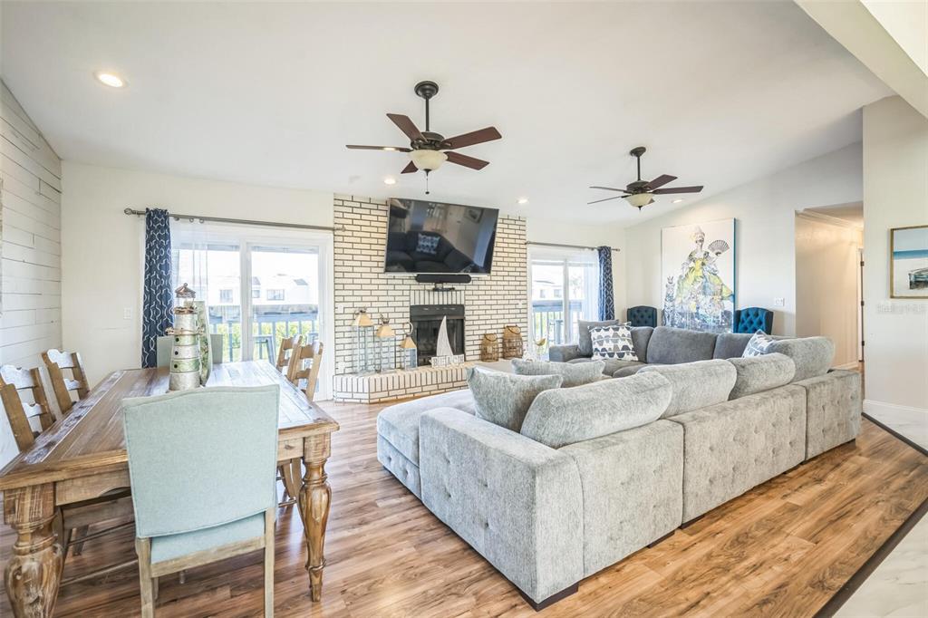 328 6th Avenue Indian Rocks Beach, FL 33785 - Photo 36 of 45 a living room with fireplace furniture and a flat screen tv