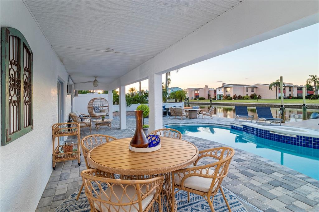 328 6th Avenue Indian Rocks Beach, FL 33785 - Photo 38 of 45 a dining room with furniture a rug and a large window