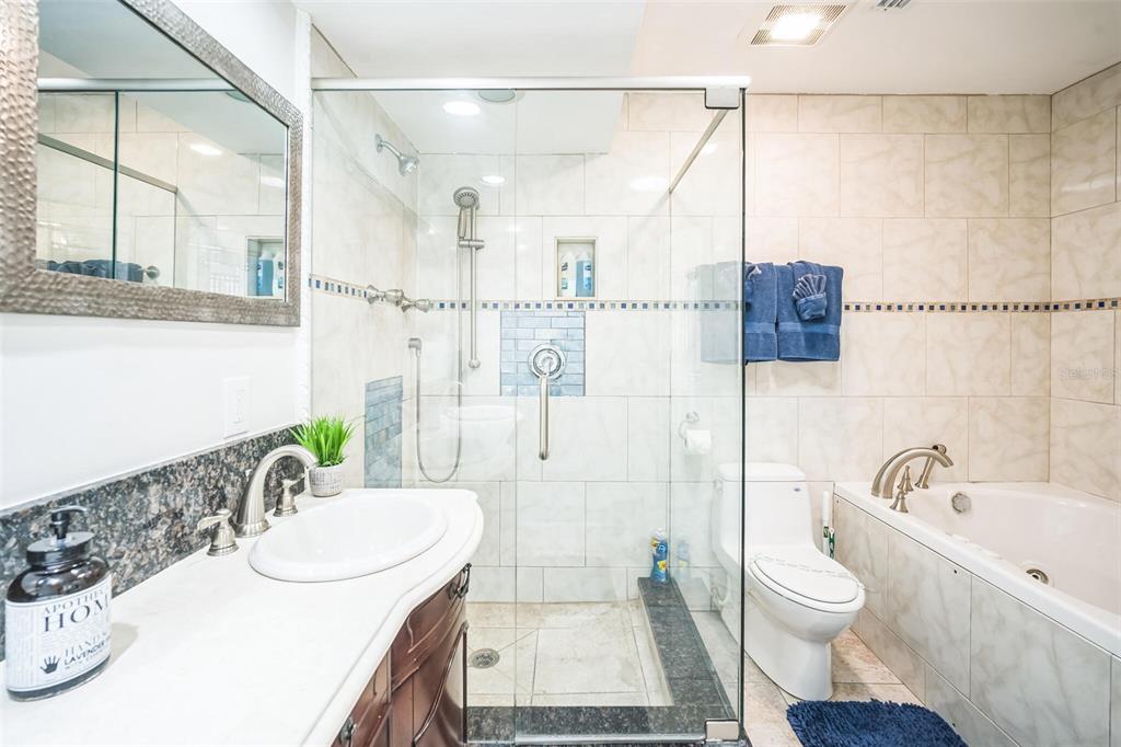 328 6th Avenue Indian Rocks Beach, FL 33785 - Photo 44 of 45 a bathroom with a sink a toilet and shower