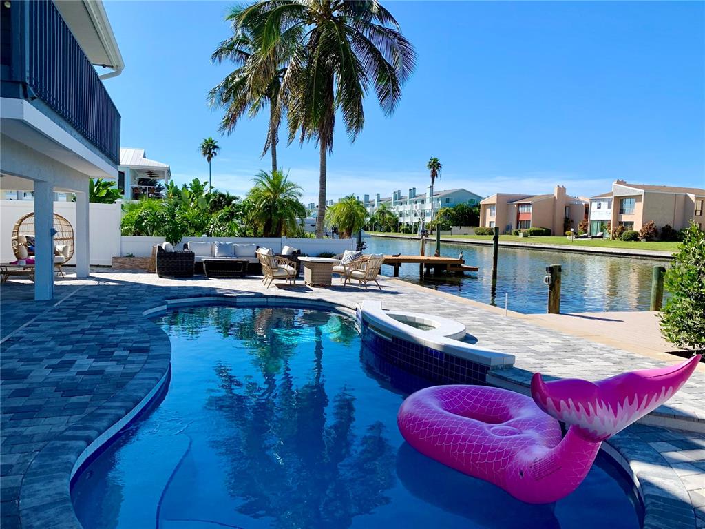 328 6th Avenue Indian Rocks Beach, FL 33785 - Photo 6 of 45 a view of a swimming pool with a seating space