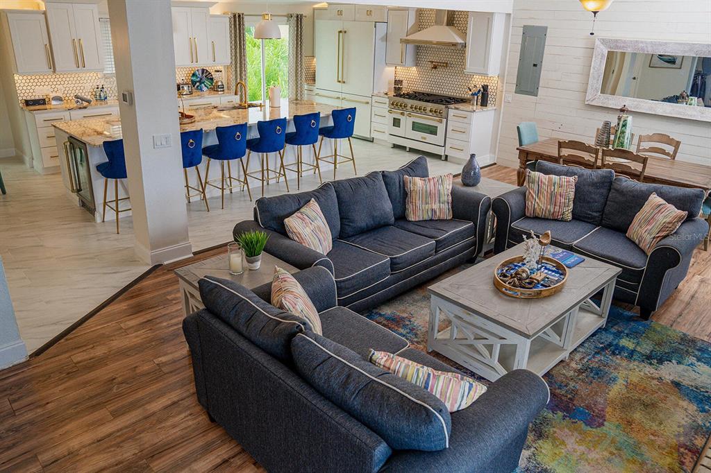 328 6th Avenue Indian Rocks Beach, FL 33785 - Photo 8 of 45 a living room with furniture and a fireplace