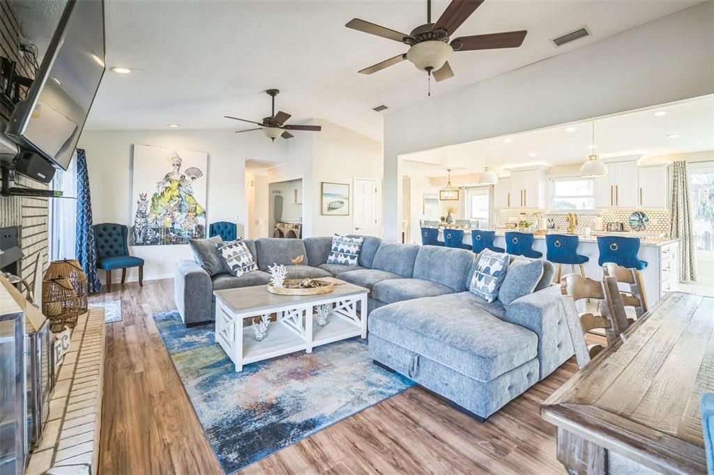 328 6th Avenue Indian Rocks Beach, FL 33785 - Photo 9 of 45 a living room with lots of furniture and a rug