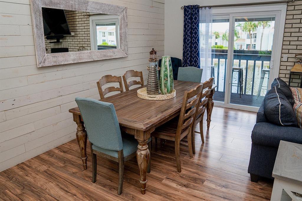 328 6th Avenue Indian Rocks Beach, FL 33785 - Photo 10 of 45 a view of a dining room with furniture window and wooden floor